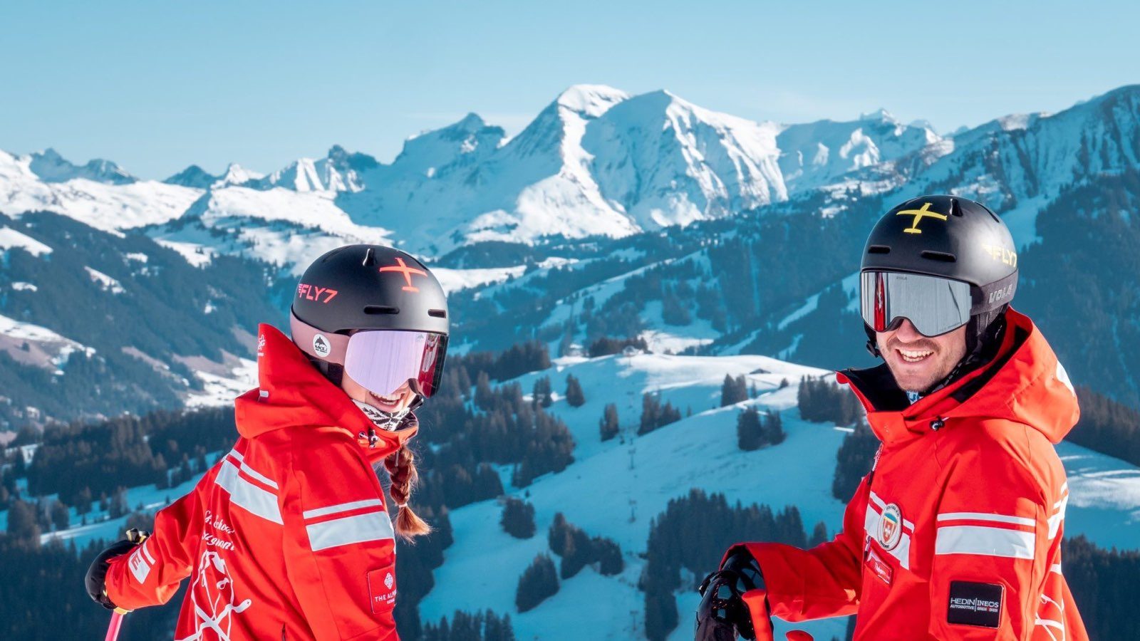 Two Swiss Ski School Rougemont instructors above the Saanenland valley